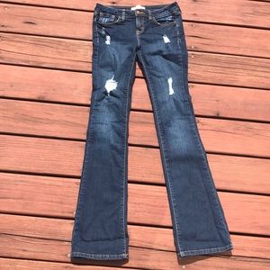 Distressed blue jeans